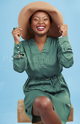 Buy stock photo Fashion, laughing and portrait of black woman with smile for style in summer isolated in studio blue background. African, hat and young person travel with clothes for glamour or luxury accessories