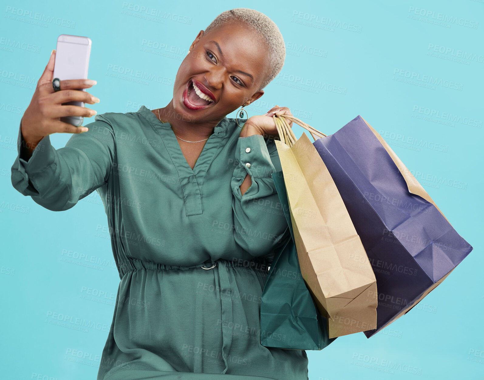 Buy stock photo Shopping bag, studio selfie and happy black woman excited for discount promotion, sales and pose for memory photo. Photography, gift and African customer post picture to online app on blue background