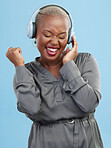 Happy black woman, headphones and listening to music, audio track or sound against a studio background. Excited African female person smile enjoying podcast, streaming or entertainment on headset