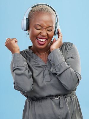 Buy stock photo Happy black woman, headphones and listening to music, audio track or sound against a studio background. Excited African female person smile enjoying podcast, streaming or entertainment on headset