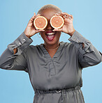 Happy black woman, orange and vitamin C in diet, natural nutrition or detox against a studio background. Portrait of African female person smile with healthy organic citrus fruit for body wellness