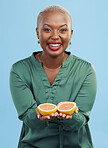 Happy black woman, portrait and orange for vitamin C in diet, natural nutrition or detox against a studio background. African female person smile with healthy organic citrus fruit for body wellness