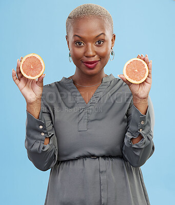 Buy stock photo Black woman, portrait and orange for vitamin C in detox, natural nutrition or diet against a studio background. Happy African female person smile with healthy organic citrus fruit for body wellness