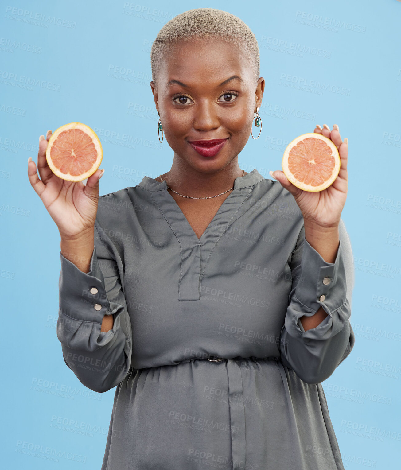 Buy stock photo Black woman, portrait and orange for vitamin C in detox, natural nutrition or diet against a studio background. Happy African female person smile with healthy organic citrus fruit for body wellness