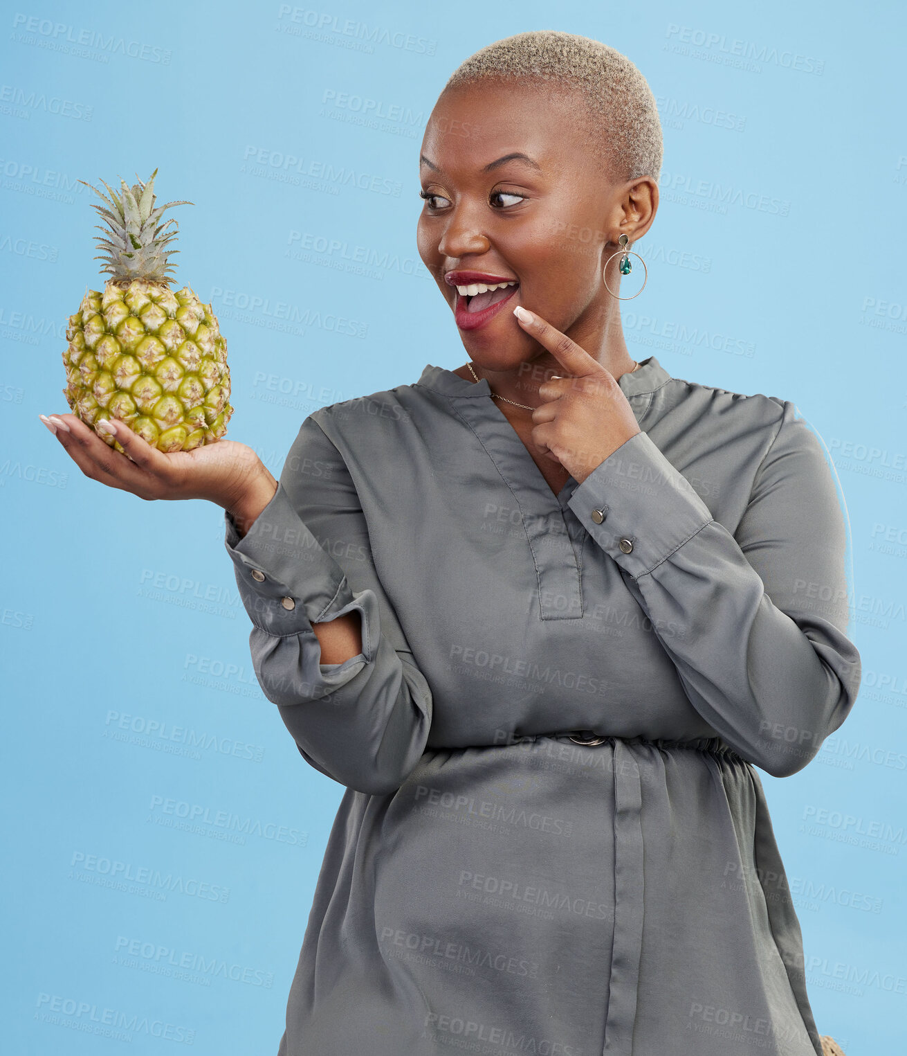 Buy stock photo Idea, pineapple for health or nutrition and a black woman in studio on a blue background for diet. Smile, fruit or food with a happy young person looking confident for healthy eating or detox