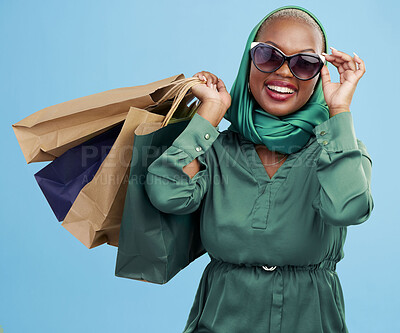 Buy stock photo Studio bag, shopping and black woman excited for holiday fashion spree, commerce discount or boutique giveaway deal. Financial freedom, luxury product and wealthy African customer on blue background