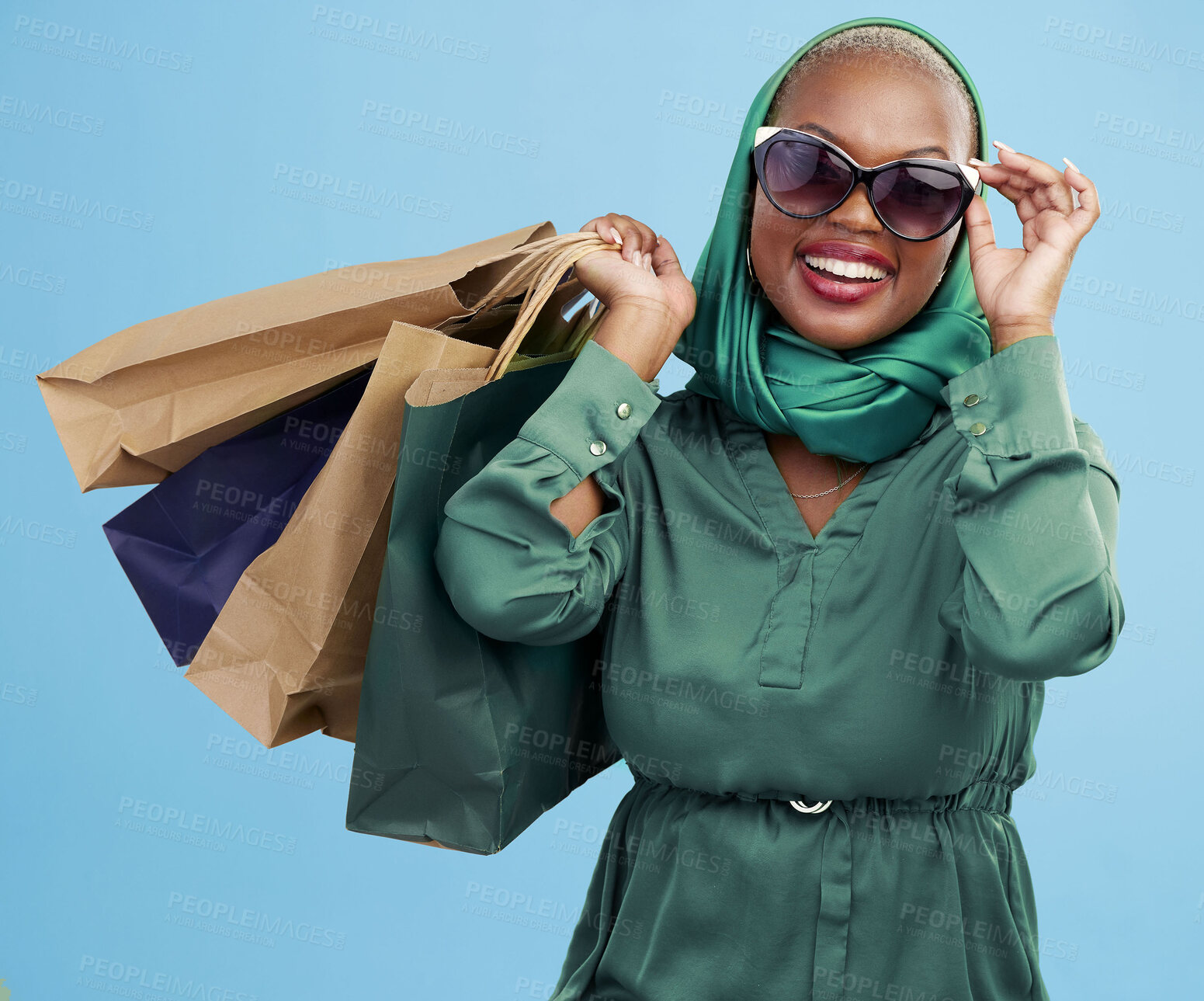 Buy stock photo Studio bag, shopping and black woman excited for holiday fashion spree, commerce discount or boutique giveaway deal. Financial freedom, luxury product and wealthy African customer on blue background