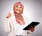 Muslim woman, thumbs up and tablet for success, like and subscribe to human resources website in studio. Portrait of business person in dubai, digital results or HR job support on a white background