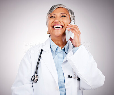 Buy stock photo Doctor, phone call and woman in studio for communication, consulting or telehealth contact on grey background. Happy mature medical surgeon laugh for mobile consultation, support or healthcare advice