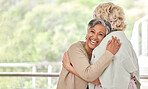 Love, hug and old woman friends on space together for a visit during retirement in a senior home. Portrait, smile and happy elderly people embracing for support, unity or solidarity while bonding 