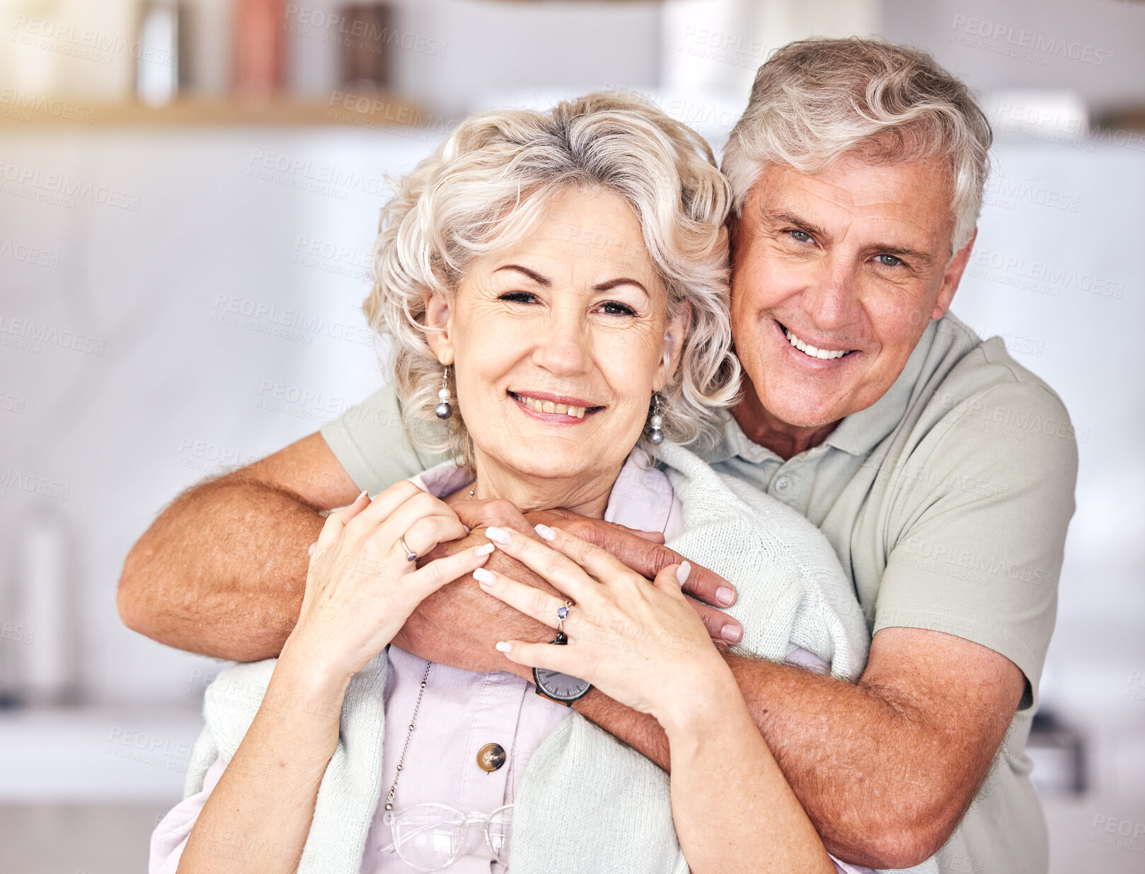 Buy stock photo Portrait, happy and senior couple hug in house for love, care and relax in retirement at home. Old man, elderly woman and smile with trust to embrace for support, commitment and loyalty in marriage