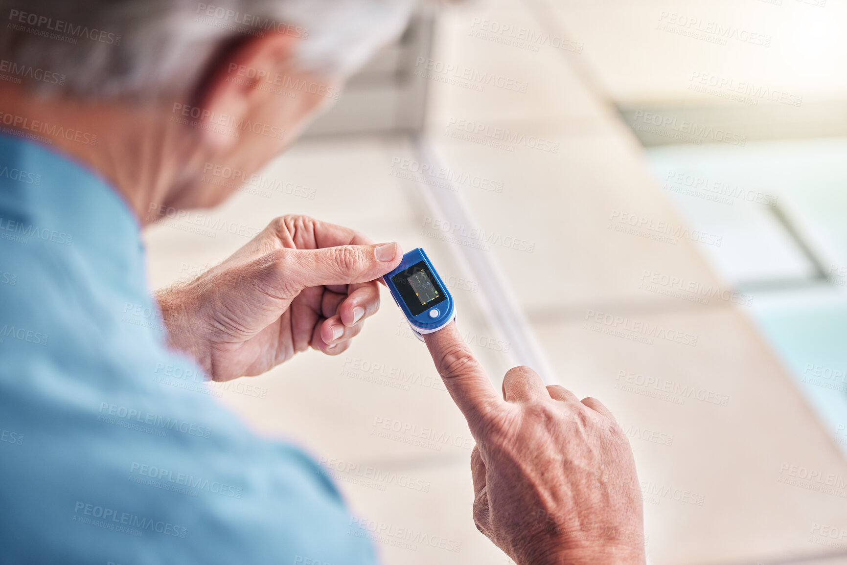 Buy stock photo Closeup, digital oximeter and elderly hands measure oxygen saturation, pulse or heart health. Finger, blood test monitor and senior man in retirement home for healthcare, medical check and wellness