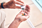 Hands, pills and bottle in closeup, home and self care with pharmaceutical product for wellness in retirement. Person, patient and medicine for healthcare supplements, vitamin and omega 3 in house