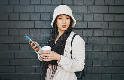 Buy stock photo City, thinking and coffee with a smartphone, woman and connection on a wall background. Person, ideas or girl with cellphone, mobile user or outdoor with digital app, tea or espresso with inspiration