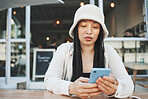 Phone, woman and reading internet chat with technology and connection at outdoor coffee shop. Smartphone, person and networking or online scroll for information, conversation and texting with network