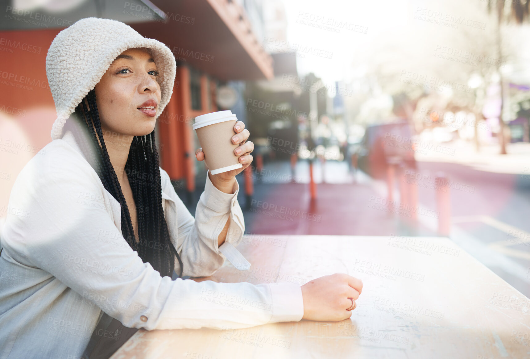 Buy stock photo Outdoor, coffee shop and woman relax with drink at cafe, restaurant or table at bistro with gen z in streetwear or urban fashion. City, style and girl in town drinking cappuccino in cup with bokeh