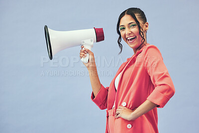 Buy stock photo Portrait, megaphone and woman with a smile, announcement and speech on a blue studio background. Face, person or model with a gender equality, communication and bullhorn with news, noise and speaking