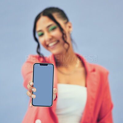 Buy stock photo Phone screen, hands and happy woman in studio for mockup, news or social media on blue background. Smartphone, space and lady person show contact, promo or sign up, information or application process