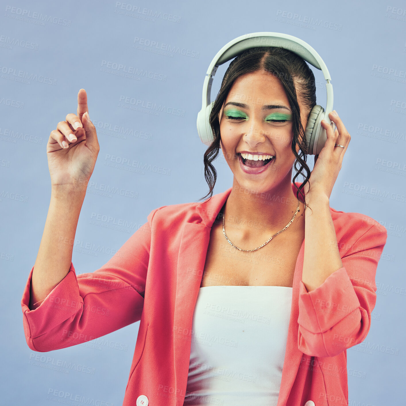 Buy stock photo Music, headphones and happy woman dance in studio with podcast, track or audio subscription on blue background. Face, smile and lady model with freedom, energy or moving to radio or feel good podcast