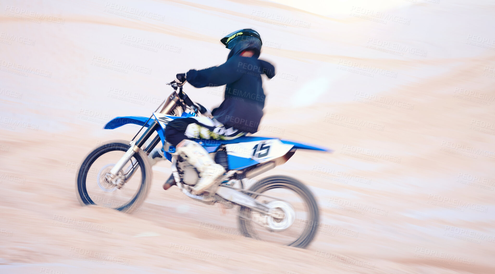 Buy stock photo Dirt, motorbike and athlete with speed in sports, adventure and driving on desert, sand dune and outdoor riding in nature. Extreme sport, bike or motorcycle drive with helmet, gear or man in action