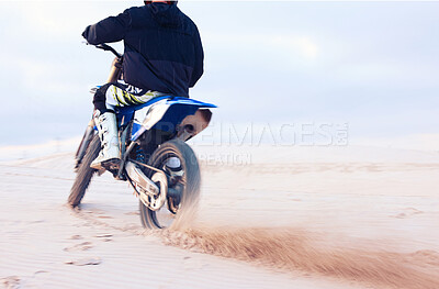 Buy stock photo Desert, dust or driver driving motorcycle for action, adventure or fitness with performance or adrenaline. Sand, back or sports athlete on motorbike on dunes for training, exercise or race challenge