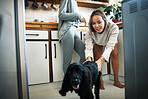 Love, dog and happy with lesbian couple in kitchen for relax, support and care. Canine animal, morning and smile with gay women and pet puppy at home for bonding, playful and happiness together