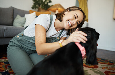 Buy stock photo Love, smile and woman with dog in home lounge to relax and play with animal. Pet owner, happy and asian person on floor with companion, care and wellness or friendship and together in cozy apartment