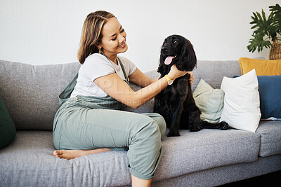 Buy stock photo Care, love and woman with dog in home sofa to relax and play with animal. Pet owner, happy and asian person on floor with companion, smile and wellness or friendship and together in cozy apartment