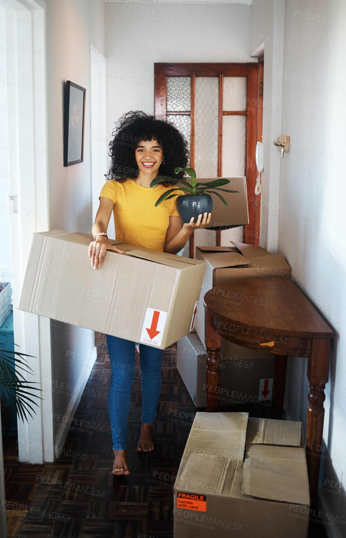 Buy stock photo Portrait, new home and woman moving box, plant and smile in apartment. Real estate, happy person with boxes and pot for packing in cardboard or unboxing for property relocation in hallway of house