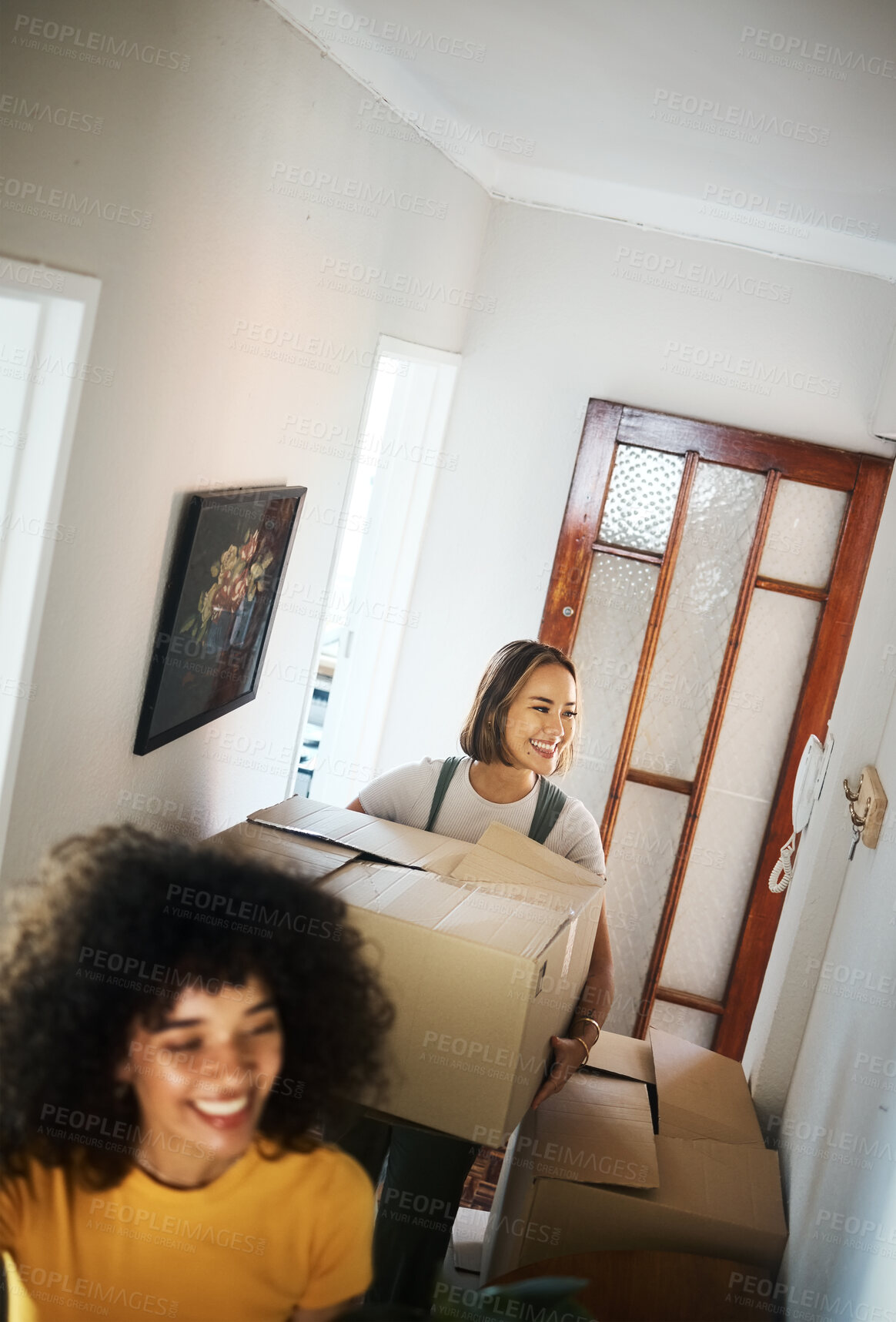 Buy stock photo Lesbians, homeowners and boxes with couple, love and happiness with achievement, real estate or moving. Queer people, women or lgbtq with property, apartment or mortgage with marriage or relationship