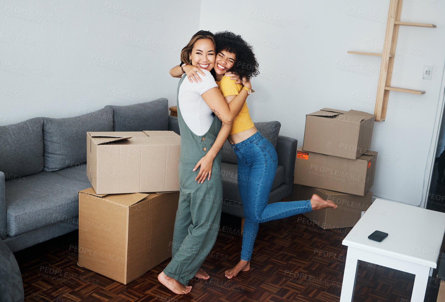 Buy stock photo Lesbian, couple and hug with moving, boxes and excited with happiness for investment in apartment or property. Happy, people and women together with love and celebration of new home together