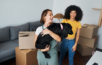 Buy stock photo Moving, lesbian and couple with dog in new home, boxes and smile in real estate together. Property, mortgage and lgbt women with puppy in living room happy and excited for pet, love and house