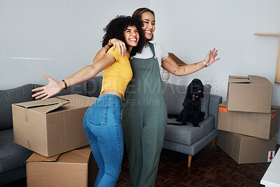 Buy stock photo Lesbian, couple and hug for moving, home and dog in living room with excited, happiness and celebration in apartment or property. Happy, people and women together with boxes and pet in new house