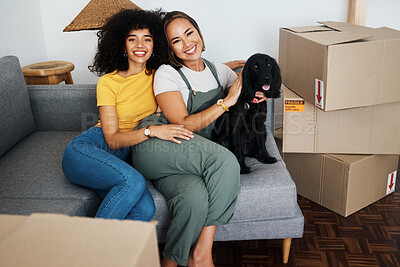 Buy stock photo Homeowner, portrait and lesbian couple with a dog on the sofa for moving boxes and a new home. Smile, lgbt and women or people on the living room couch of an apartment with a pet after relocation