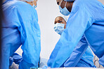 Doctors, hospital and surgeon team in theatre and emergency, healthcare or medical procedure. Group or staff with collaboration, healing or surgery and operation with support and scrubs in ICU