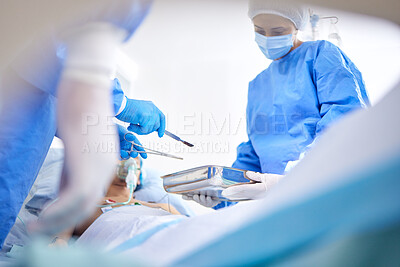 Buy stock photo Tools, hospital and surgeon team in theatre for emergency, healthcare or medical procedure. Doctors with a patient for collaboration, scalpel or surgery and operation with support and scrubs in ICU