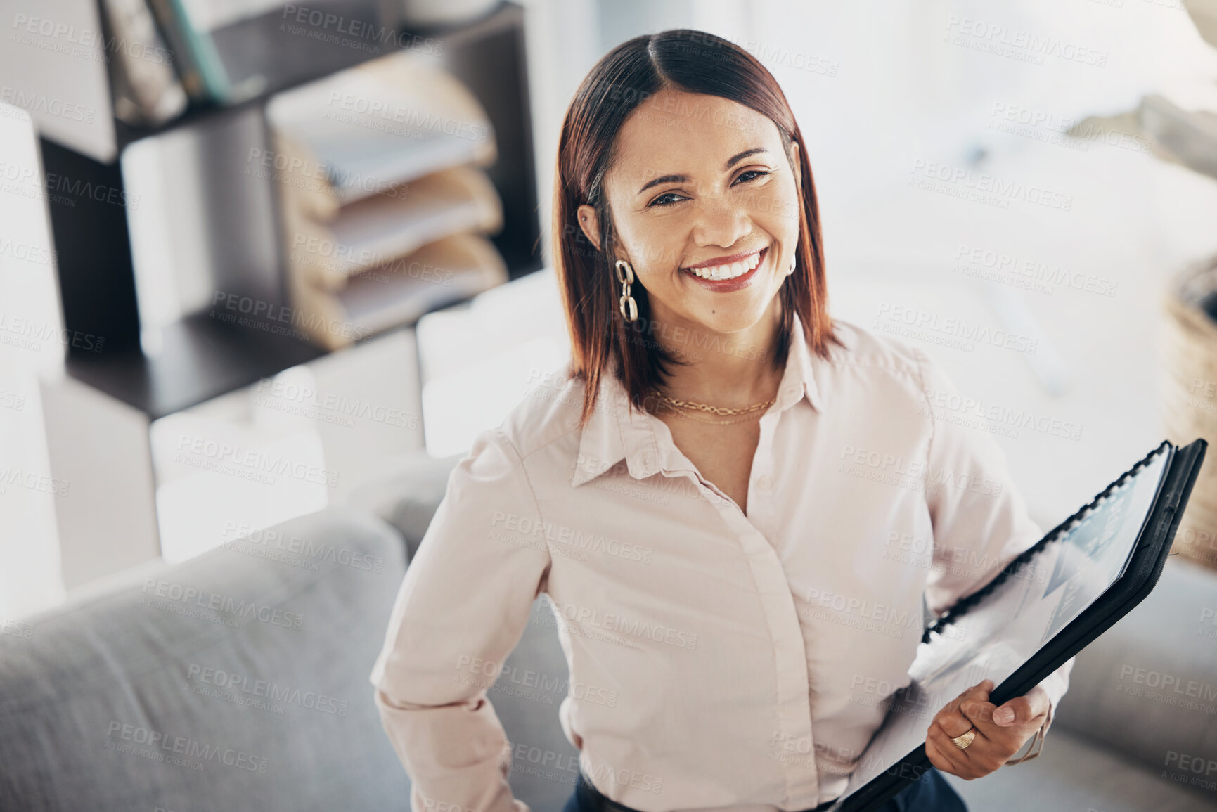 Buy stock photo Happy, paperwork and portrait of businesswoman in office with positive, good and confident attitude. Smile, creative career and top view of female designer from Colombia standing in modern workplace.