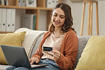 Laptop, credit card and ecommerce with a woman in her home for bank payment or accounting. Computer, finance or budget with a happy young customer in the living room for online shopping or retail