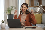 Woman, laptop and headphones for music, home and dancing at desk with inspiration for remote work. Freelance entrepreneur, audio streaming app and listening to radio with smile, computer and sound