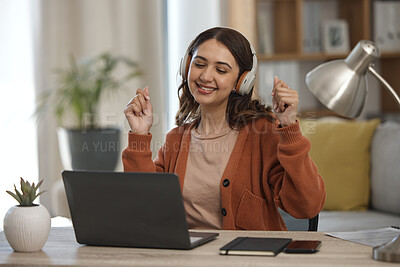 Buy stock photo Woman, laptop and headphones for music, home and dancing at desk with inspiration for remote work. Freelance entrepreneur, audio streaming app and listening to radio with smile, computer and sound