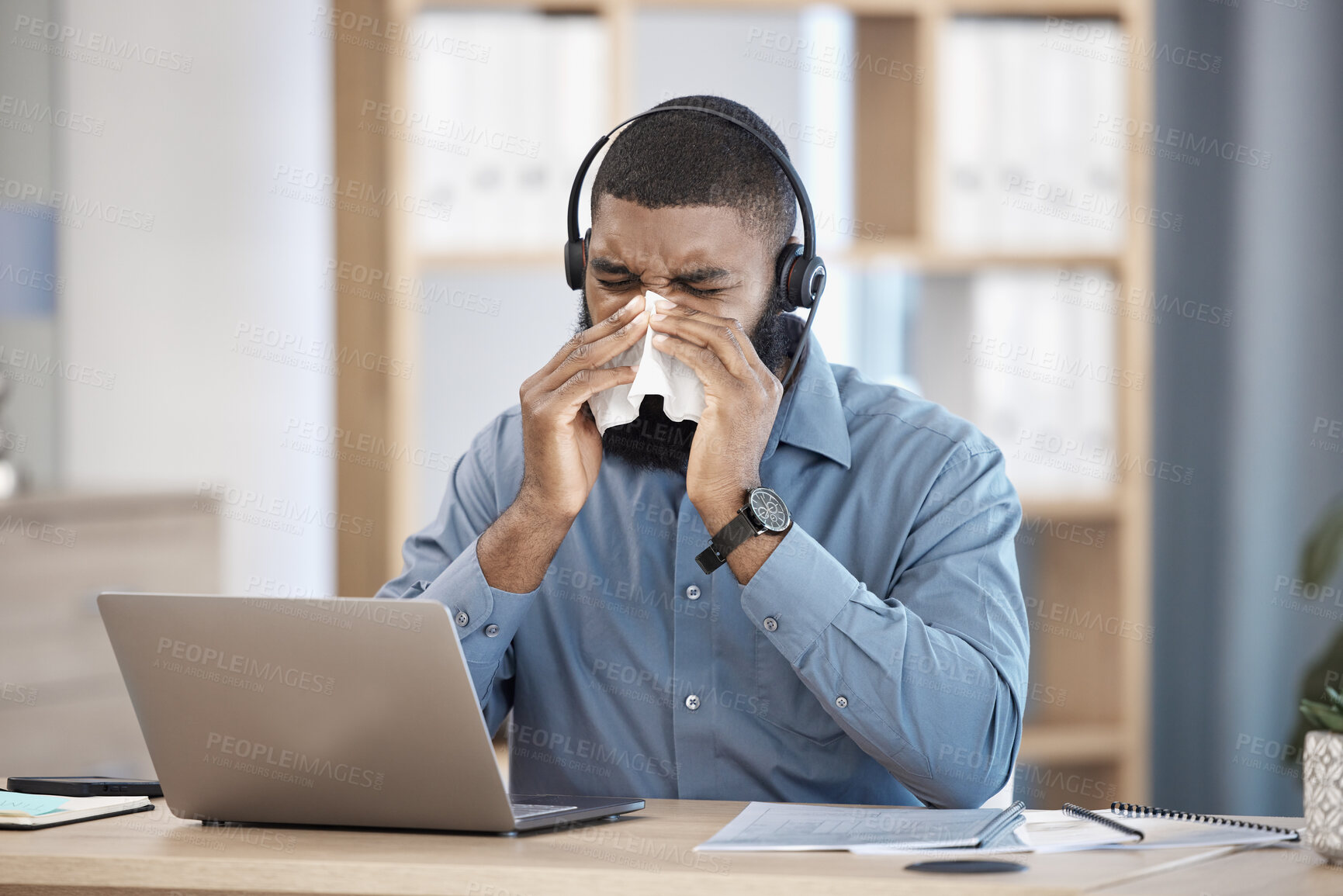 Buy stock photo Laptop, sneeze and black man with telemarketing, call center and sick with allergy, professional and customer service. African person, employee and consultant with a tissue, customer service and sick