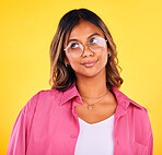 Thinking, fashion and face of woman on yellow background with ideas, confidence and thought. Beauty, style and isolated person with attitude in trendy clothes, stylish outfit and glasses in studio