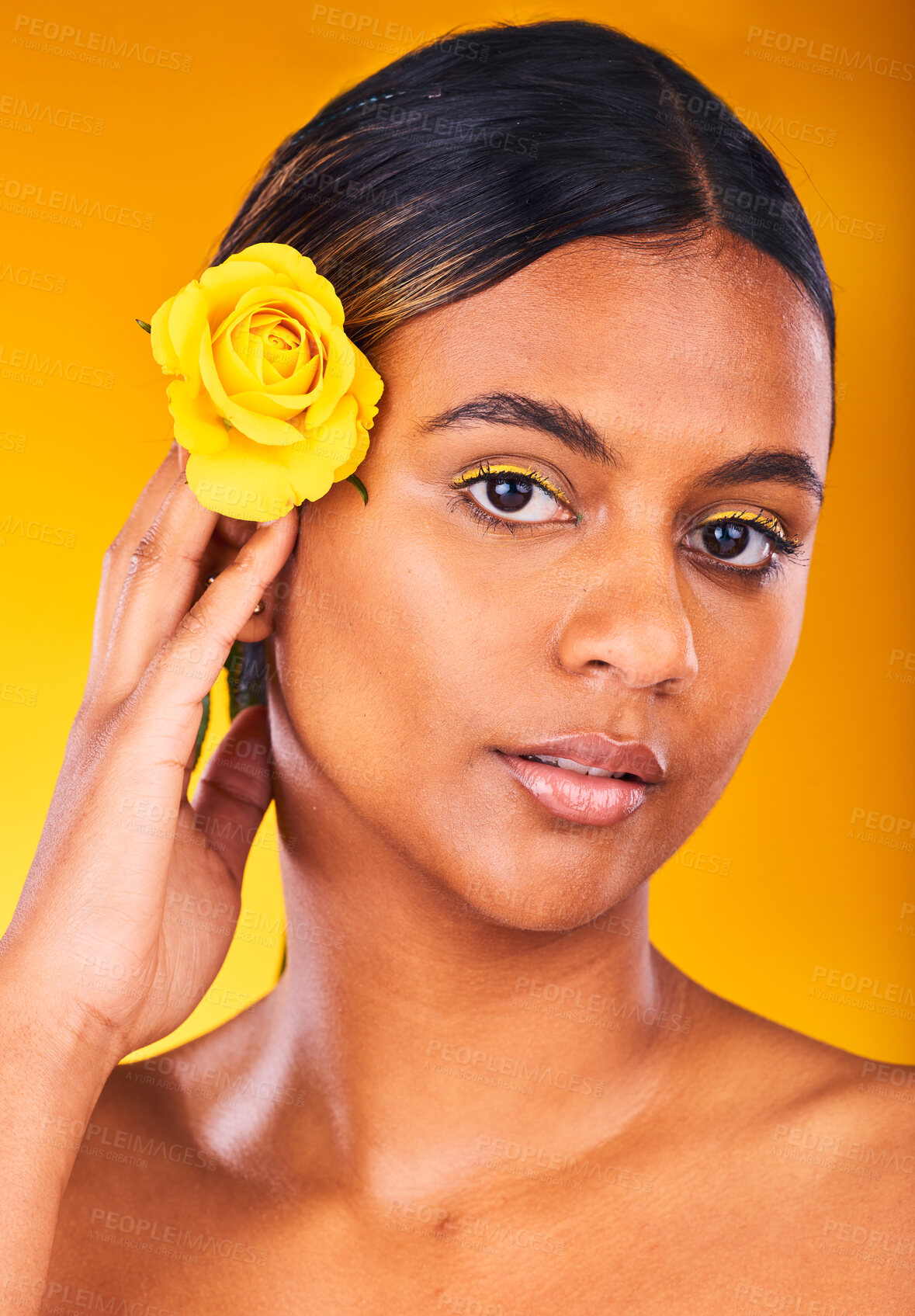 Buy stock photo Skincare, flower and portrait of woman in studio with beauty, glow and cosmetic face routine. Makeup, rose and young female model from Mexico with facial treatment isolated by yellow background.