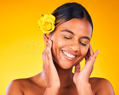 Buy stock photo Cosmetic, flower and young woman in studio with beauty, glow and skincare face routine. Makeup, rose and female model from Mexico with facial dermatology treatment isolated by yellow background.