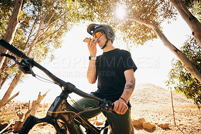 Buy stock photo Man, forest and phone call in nature on mountain bike, cycling and workout with internet. Athlete, voice record and sportswear with communication, technology, healthy life and extreme sports