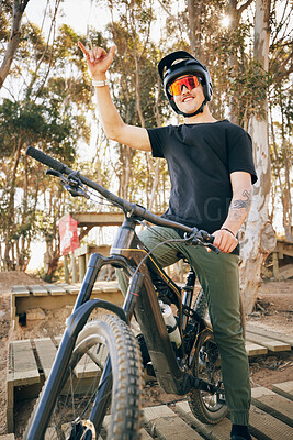 Buy stock photo Bike, adventure and hand gesture with a sports man outdoor in a park for off ride riding during a race. Fitness, exercise and bicycle with a young athlete training for a competition in the forest