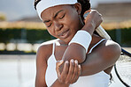 Black woman, tennis and elbow pain from injury, fitness or outdoor athlete in medical emergency or joint inflammation. African female person or sports player with sore arm, ache or accident in match