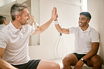 Locker room, sports and men high five for tennis training, exercise and workout for practice or match. Fitness, friends and happy people with celebration for winning, performance and competition