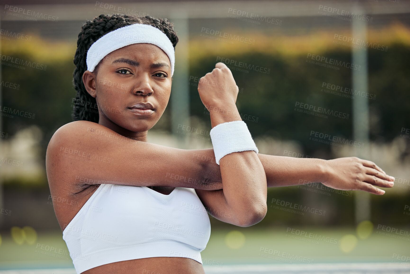 Buy stock photo Sports, portrait and woman tennis player doing warm up for practice to play match at stadium. Fitness, serious and African female athlete with stretching exercise for training on court for tournament