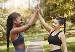 Woman, friends and high five in nature for fitness, teamwork or outdoor training goals together. Female person touching hands in celebration for team exercise, running or sports practice at the park